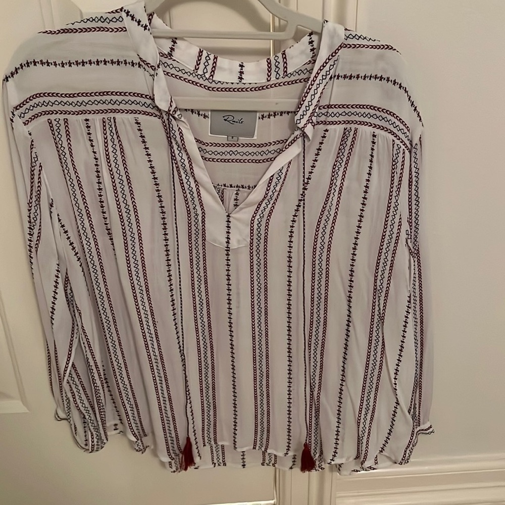 White blouse with red and blue stripes